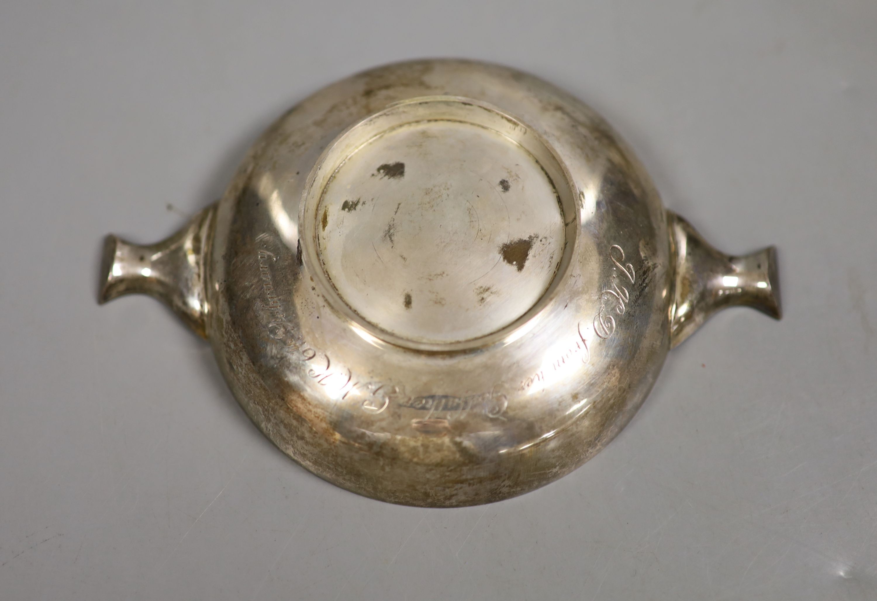 An Edwardian silver quaich, Chester, 1904, 12.1cm and a similar George V quaich, London, 1924, 6.5oz.